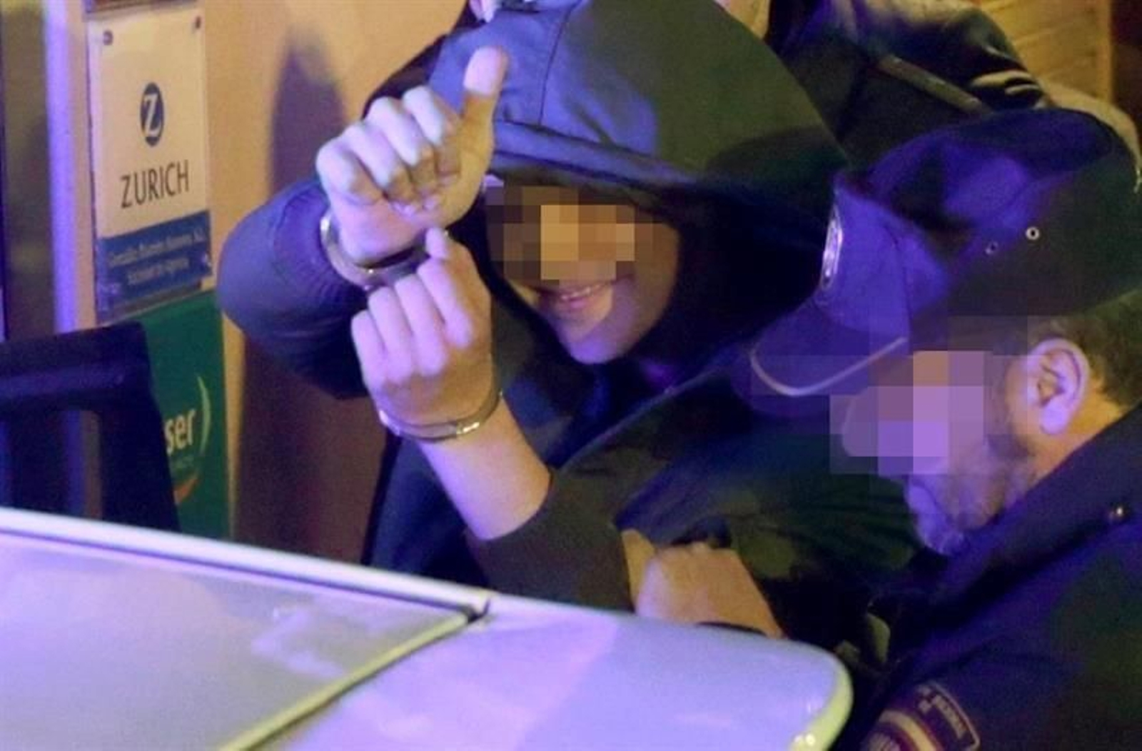 El joven acusado de agredir al presidente del Gobierno, Mariano Rajoy, durante un paseo electoral, tras ser detenido esta tarde en Pontevedra.