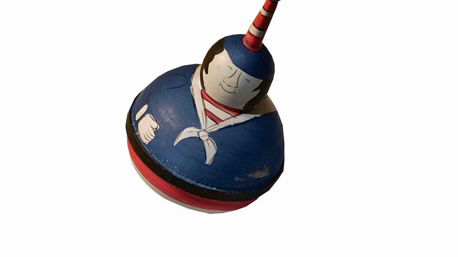 En forma de sonriente muñeca.