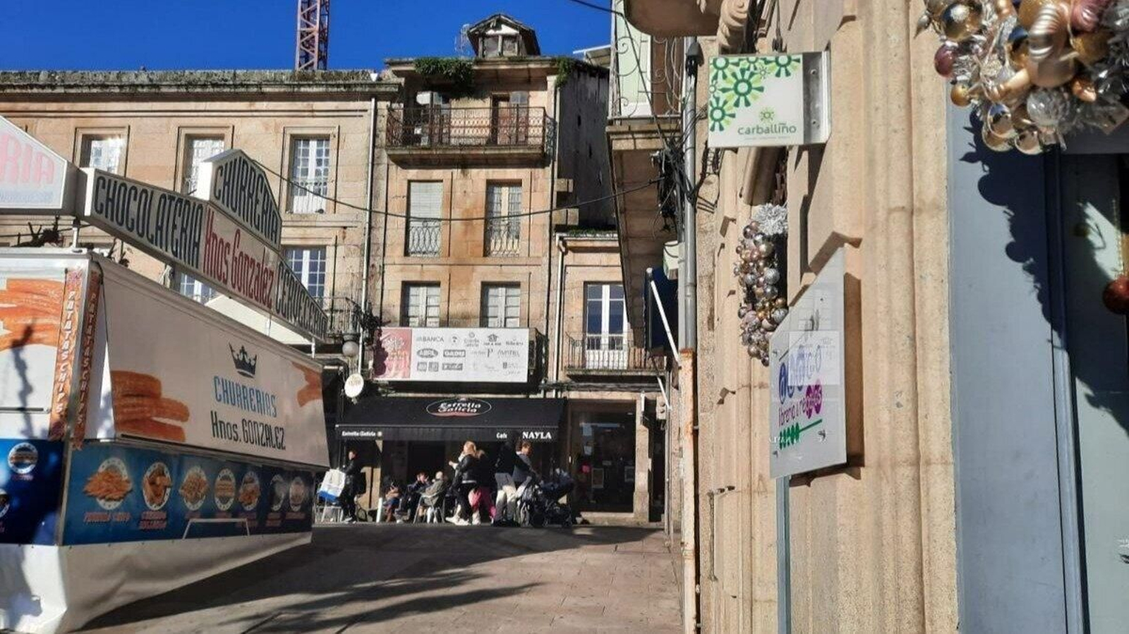 La marca del Centro Comercial Aberto en uno de los establecimientos asociados.